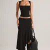 Falda midi asimétrica de talle bajo Niva Modal en negro