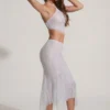Falda midi-longitud Jordana con bajo en forma de pañuelo y adornos en color plateado
