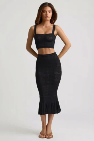 Falda midi Yasira con volantes y tejido de punto calado en negro