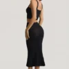 Falda midi Yasira con volantes y tejido de punto calado en negro