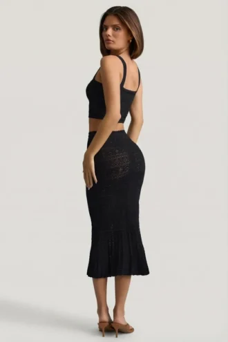 Falda midi Yasira con volantes y tejido de punto calado en negro