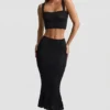 Falda midi Yasira con volantes y tejido de punto calado en negro