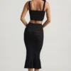 Falda midi Yasira con volantes y tejido de punto calado en negro