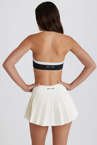 Falda-pantalón de tenis plisada de talle bajo y tejido suave en color marfil
