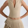 Falda plisada de corte bajo con capas de Nada en color camel