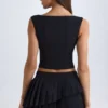 Falda plisada de corte bajo con capas Nada en negro
