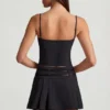 Falda plisada de talle bajo con cinturón Velora en negro