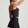 Falda plisada de talle bajo con cinturón Velora en negro