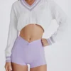 Jersey corto de punto trenzado de algodón en lila y marfil