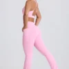 Leggings acampanados Soft Active con cintura en V y bolsillos en rosa bebé