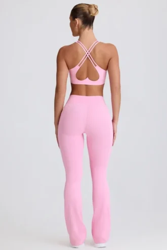 Leggings acampanados Soft Active con cintura en V y bolsillos en rosa bebé