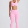 Leggings acampanados Soft Active con cintura en V y bolsillos en rosa bebé