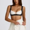 Mini falda-pantalón plisada con cruce, de tejido suave y deportivo, en color marfil