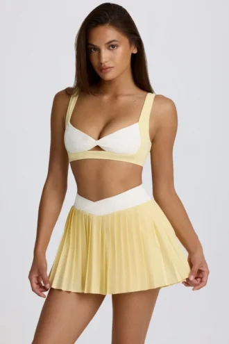 Mini falda-pantalón plisada cruzada Soft Active en color limón