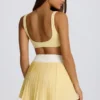 Mini falda-pantalón plisada cruzada Soft Active en color limón