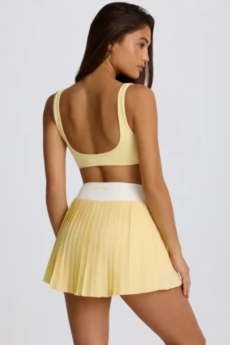 Mini falda-pantalón plisada cruzada Soft Active en color limón