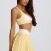 Mini falda-pantalón plisada cruzada Soft Active en color limón