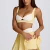 Mini falda-pantalón plisada cruzada Soft Active en color limón