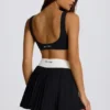 Mini falda-pantalón plisada Soft Active Crossover en negro