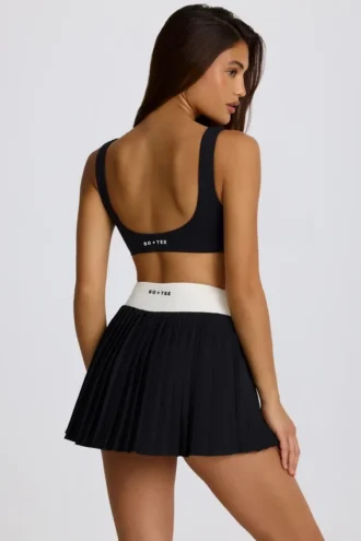 Mini falda-pantalón plisada Soft Active Crossover en negro