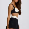 Mini falda-pantalón plisada Soft Active Crossover en negro