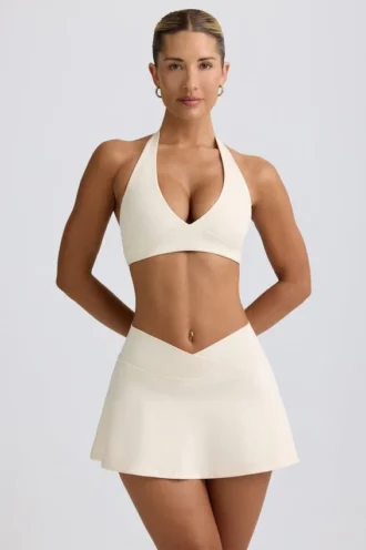 Minifalda-pantalón cruzada de jersey cepillado en marmolado marfil