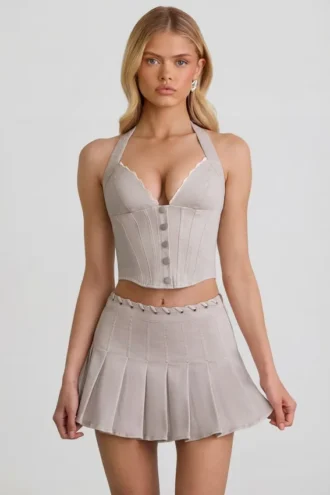Minifalda plisada de talle bajo Laika en color crudo