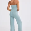 Mono bandeau de punto grueso con pernera acampanada en verde azulado apagado