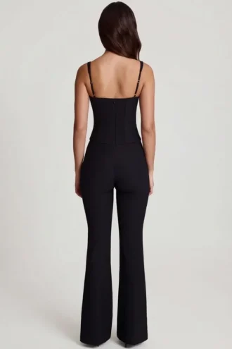 Mono Elanie con cuello redondo, corsé y pernera acampanada en negro