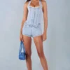 Mono Lalita con cuello halter y botones en denim claro