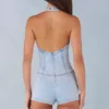 Mono Lalita con cuello halter y botones en denim claro