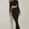 Pantalones acampanados asimétricos con drapeado y talle medio Mairead en negro