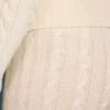 Pantalones acampanados con vuelta y punto trenzado en color crema