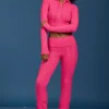Pantalones acampanados con vuelta y punto trenzado en rosa intenso