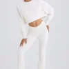 Pantalones acampanados de jersey de algodón texturizado en blanco