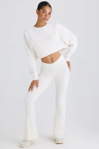 Pantalones acampanados de jersey de algodón texturizado en blanco