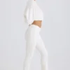 Pantalones acampanados de jersey de algodón texturizado en blanco