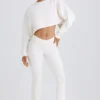 Pantalones acampanados de jersey de algodón texturizado en blanco