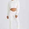 Pantalones acampanados de jersey de algodón texturizado en blanco