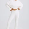 Pantalones acampanados de jersey de algodón texturizado en blanco