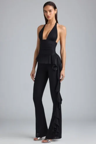 Pantalones acampanados de talle bajo con volantes metalizados Reese en negro