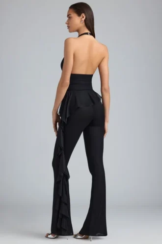 Pantalones acampanados de talle bajo con volantes metalizados Reese en negro