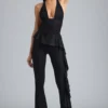Pantalones acampanados de talle bajo con volantes metalizados Reese en negro
