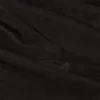 Pantalones acampanados de talle bajo con volantes metalizados Reese en negro