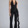 Pantalones acampanados de talle bajo con volantes metalizados Reese en negro
