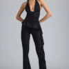 Pantalones acampanados de talle bajo con volantes metalizados Reese en negro