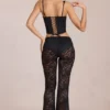 Pantalones acampanados de talle medio de encaje transparente Calista en negro