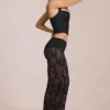Pantalones acampanados de talle medio de encaje transparente Calista en negro