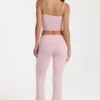 Pantalones acampanados de talle medio en modal color rosa palo