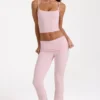 Pantalones acampanados de talle medio en modal color rosa palo